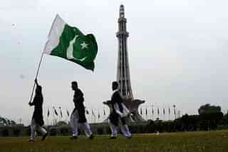 Pakistan citizens with the national flag.