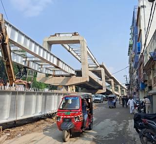 The double decker flyover under construction. The same stretch also has the metro underground. 
(Source: Swarajya)