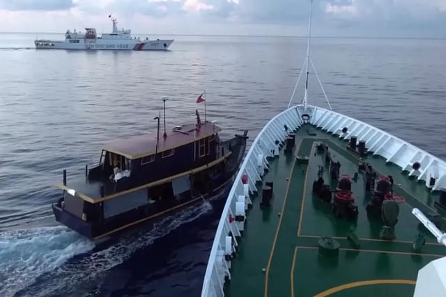 Chinese coast guard vessel preventing a Phipippines re-supply mission to Sierra Madre. (Image via Reuters)