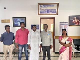 Ananthan with the principal and management of the college