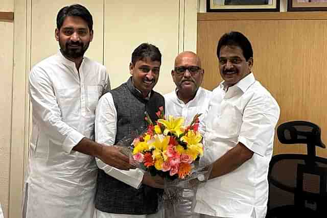 Imran Masood in a black coat with Ajay Rai (right) and KC Venugopal (far right)