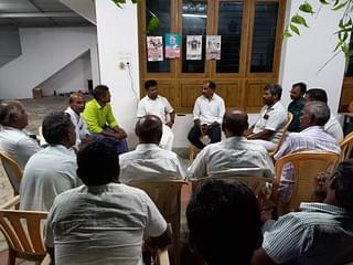 Political discussion at Ananthan's home