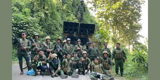Rebels pose with weapons and artillery captured from junta forces at Kunlong in northern Shan province.