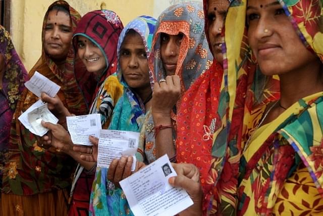 Women lined up outside a polling booth in Rajasthan.