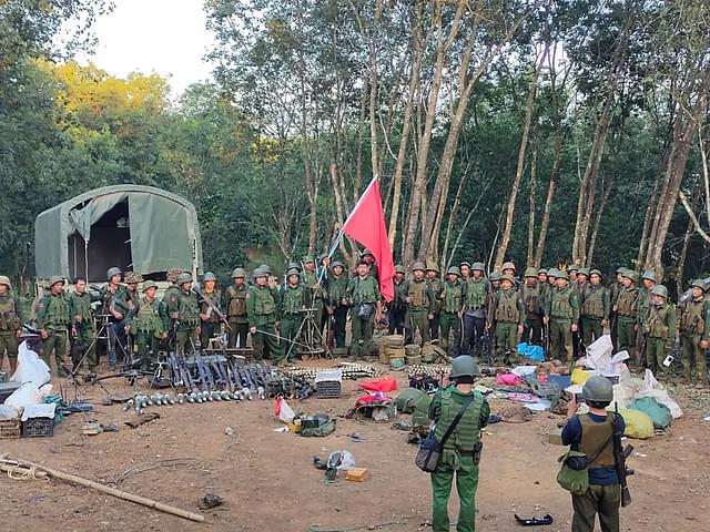 Rebel soldiers of Brotherhood Alliance with arms captured from junta troops