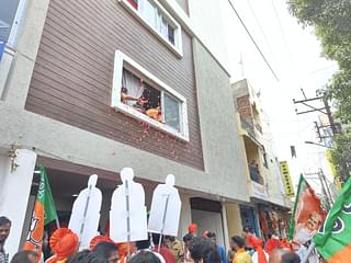Singh's supporters welcome him home with flowers showered from their buildings (Sharan Setty/Swarajya)