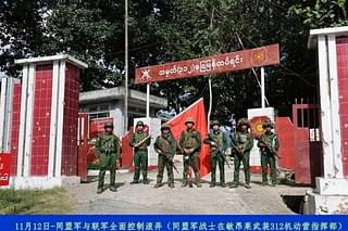 Rebels pose outside a major junta HQs in Kunlong town in Shan state earlier this week