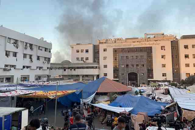 Smole blowing out near Gaza Strip's largest hospital — Al-Shifa. (Pic via Reuters/ @Doaa Rouqa )