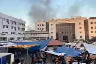 Smole blowing out near Gaza Strip's largest hospital — Al-Shifa. (Pic via Reuters/ @Doaa Rouqa )