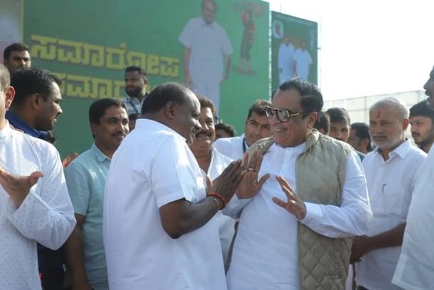 JD(S) leader HD Kumaraswamy shares a laugh with CM Ibrahim.