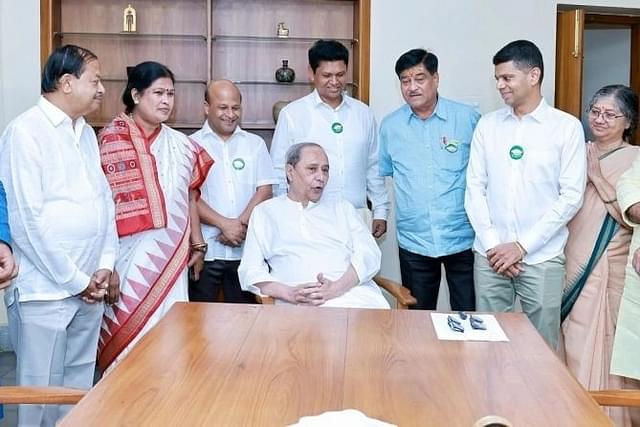 Pandian (second from right) at Naveen Niwas where he joined the BJD in presence of Naveen Patnaik (seated) Monday