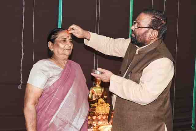 Swami Prasad Maurya "worshipping" his wife on Diwali 2023