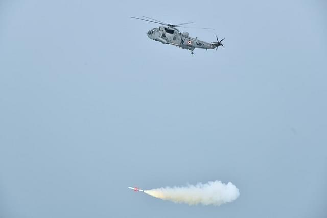 Indian Navy's SeaKing Mk42B helicopter firing the missile. (Pic via X @ReviewVayu)
