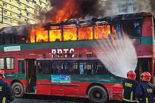 A public bus set on fire by opposition protestors in Dhaka Monday. (20 November)