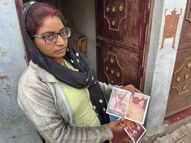 Seema Gupta shows pictures of her father's bullet-ridden body