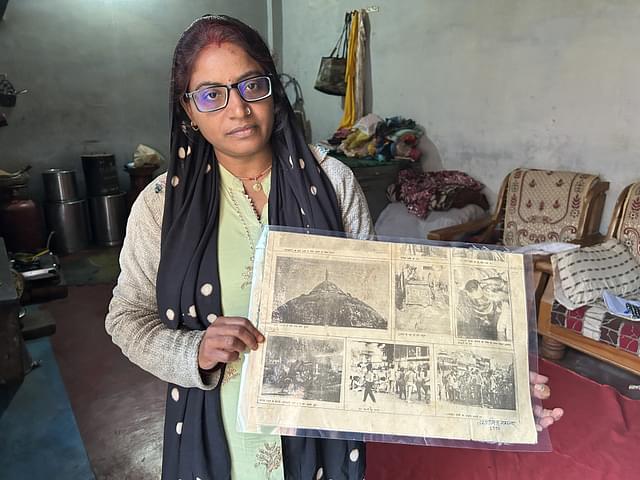 Seema shows newspaper reports on her father's death