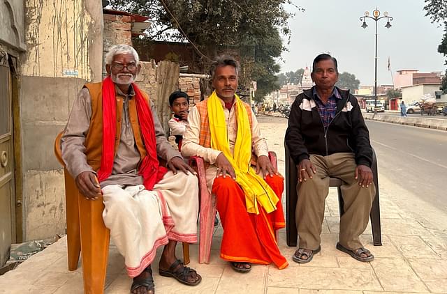 Sheetla Prasad Pandey (middle) with his neighbours in Panji Tola mohalla in Ayodhya