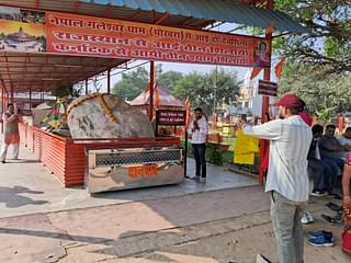 Devotees paying their respect to the ancient rocks brought to create statues of Lord Rama and Sita.  
(Source: Swarajya) 