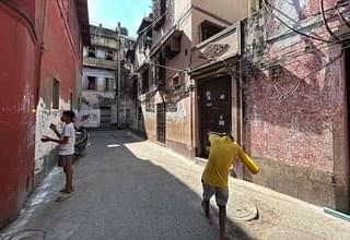 Children playing outside the house where Purnima Kothari lives (orange house on the right)