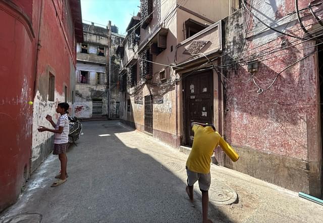 Children playing outside the house where Purnima Kothari lives (orange house on the right)