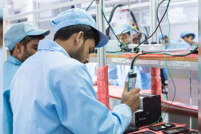 A phone manufacturing line in a Dixon Technologies facility. The company is the largest contract manufacturer of phones in India.  (Photo Credit: Dixon Technologies.)