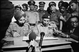 Pakistan's Eastern army commander Lt. General A A K Niazi signing the surrender document.