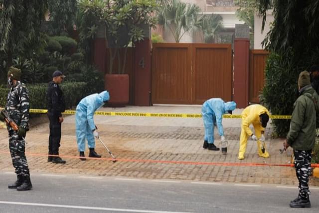 Members of the forensic unit of Indian National Security Guard (NSG) collect samples near the Israeli embassy in New Delhi.