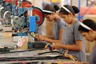 India's manufacturing sector is creating job opportunities. (SAM PANTHAKY/AFP/GettyImages)