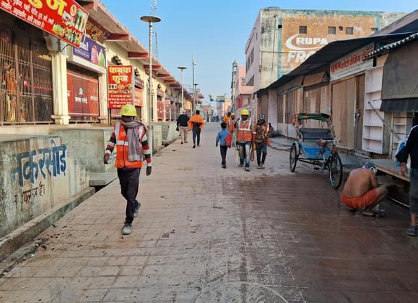 Workers going for their shift early morning. Many workers can be spotted each day on the town's streets who are working on the temple's construction. (Source: Swarajya)