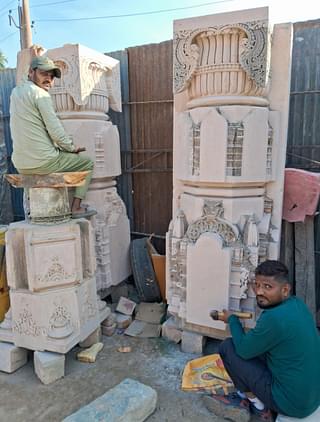 Artisans Virendra Kumar and Ajay Damor recreating the carvings on the pillars. (Source: Swarajya)