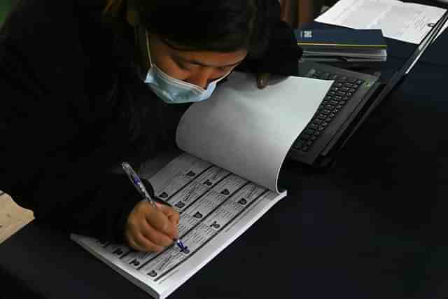 An election official is seen inside a polling station in Thimphu, Bhutan.