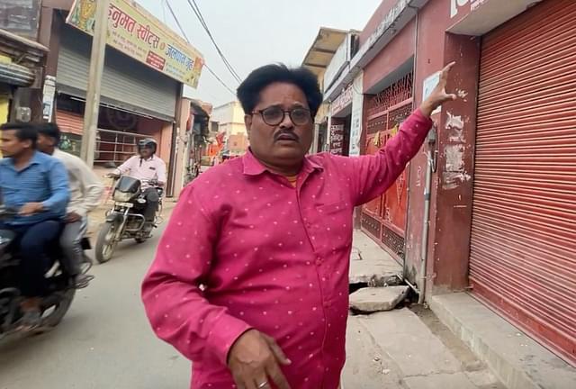 A recent picture of Mahendra Tripathi, standing in the colony where he clicked Karsevak deaths in 1990.