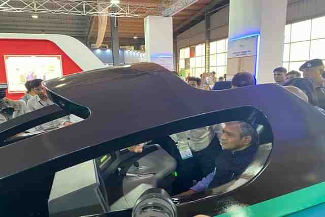 Railway Minister Ashwini Vaishnaw taking a ride on Bullet Train simulator at the Vibrant Gujarat event.