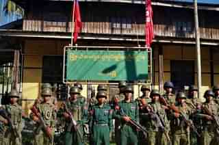 Arakan Army troops in front of the administrative building of Paletwa town it captured this week