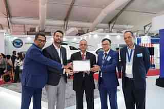 Sunny Guglani, (second from left) Head of Airbus Helicopters, Airbus India and South Asia presenting the H145 model to Heligo Charters Private Limited.