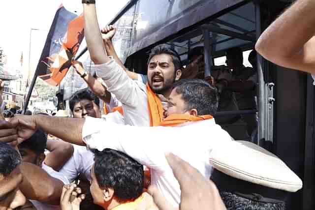 President, BJP Bengaluru Central, Sapthagiri Gowda being detained by the police near Mysore Bank circle in Bengaluru. (BJP Karnataka/X)