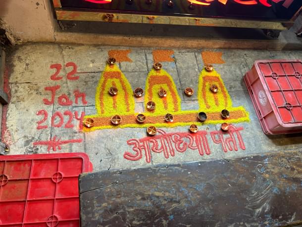 A rangoli outside a shop