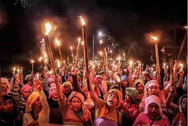 Meitei women protesting the state's inability to stop violence in Manipur.