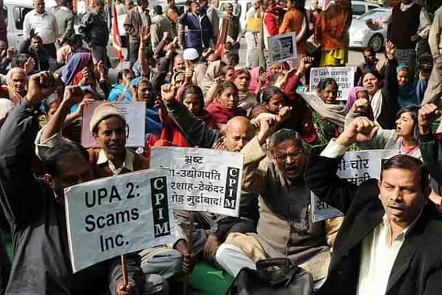 Demonstrators stage a rally against UPA-2 scams in New Delhi.
Photo credit: RAVEENDRAN/AFP/GettyImages &nbsp;    