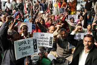 Demonstrators stage a rally against UPA-2 scams in New Delhi.
Photo credit: RAVEENDRAN/AFP/GettyImages &nbsp;    