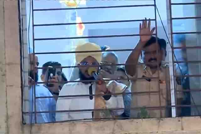 Islamic preacher detained in police station (still from ANI video)