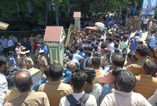 Protestors in front of St Gerosa School in Karnataka's Mangaluru.