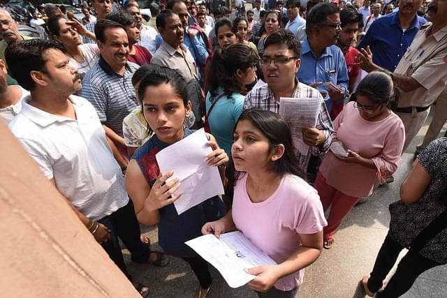 Students check entrance exam results. (Raj K Raj/Hindustan Times via GettyImages)