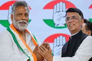 Pappu Yadav with Congress leader Pawan Khera.