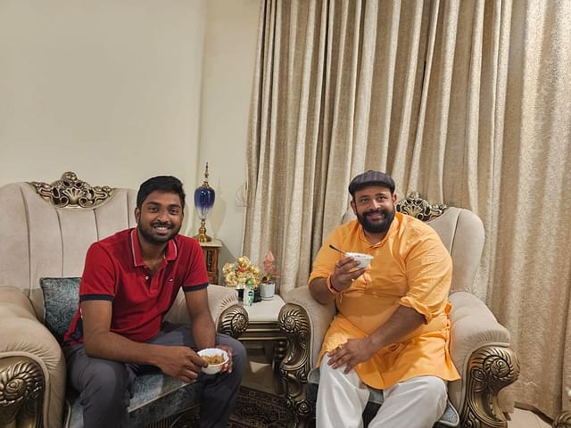 Sharing a delicacy with the Rajkumar at his residence.