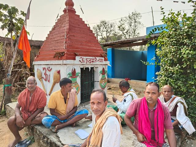 Locals gathered near the Hanuman temple in the village.