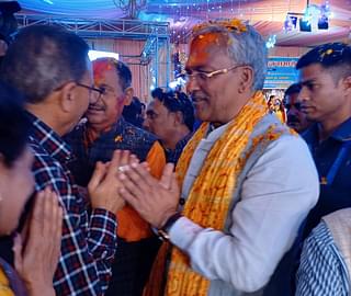 Rawat greets supporters.