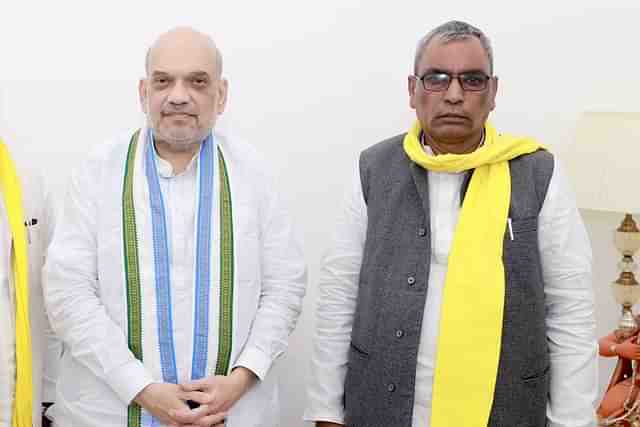 A picture captures Union home Minister Amit Shah and OP Rajbhar together.