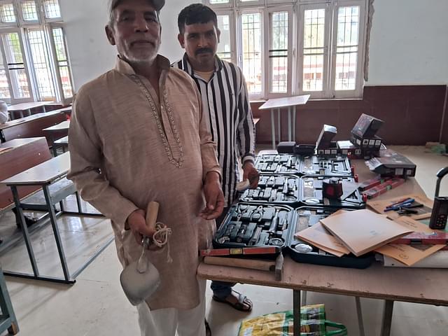 Masons with their old and new tools. (AnkitSaxena/Swarajya)
