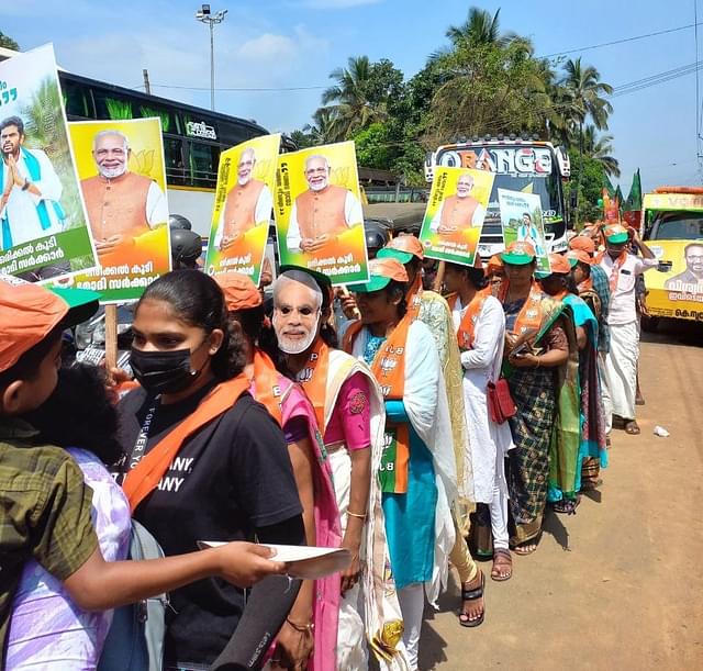 Women at the roadshow carrying Modi and Annamalai placards. (S Rajesh)